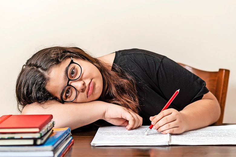 1218194773 young girl tired of studying